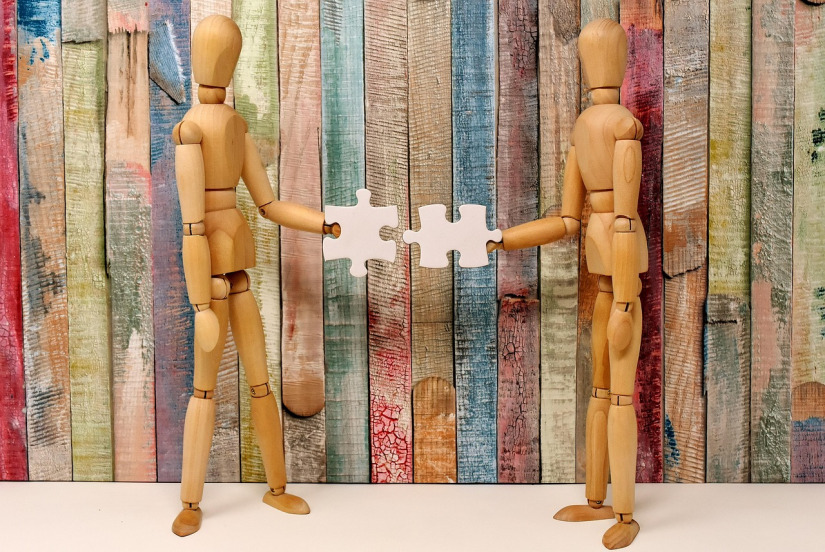 kids hands puzzle pieces